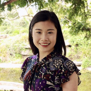 A lady smiles at the camera